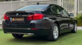 2012 BMW 5 Series 523i Sedan — rear, left side