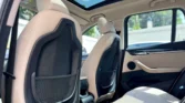 2020 BMW X1 2.0 sDrive20i xLine — cabin from rear, sunroof open