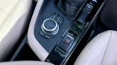 2020 BMW X1 2.0 sDrive20i xLine — console, iDrive controller and parking brake